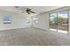 Spacious main bedroom with carpet flooring and a sliding door to the balcony at 42209 N 46Th Ln, Phoenix, AZ 85086