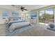 Light-filled bedroom featuring a king bed, serene decor, and a private balcony at 42209 N 46Th Ln, Phoenix, AZ 85086
