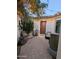 Inviting front patio with chair, Buddha statue, water feature, and string lights at 44610 N Sonoran Arroyo Ln, New River, AZ 85087