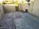 The backyard has a block wall and a mix of stone and concrete paving at 4650 E Wood St, Phoenix, AZ 85040