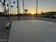 Community basketball court showing palm trees with a bench for spectators at 4650 E Wood St, Phoenix, AZ 85040