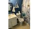 Charming bathroom with floral accents and functional fixtures at 4650 E Wood St, Phoenix, AZ 85040