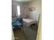 Cozy bedroom featuring two beds, carpeted floors, and neutral walls at 4650 E Wood St, Phoenix, AZ 85040