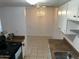 Eat-in kitchen with appliances, tiled floors, and a chandelier at 4650 E Wood St, Phoenix, AZ 85040