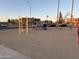 Outdoor playground with swing set and slide with nearby parking at 4650 E Wood St, Phoenix, AZ 85040