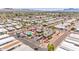 Aerial view of community amenities, featuring a pool, clubhouse, and mature landscaping at 652 S Ellsworth Rd # 92, Mesa, AZ 85208