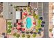 Aerial view of sparkling pool with lounge chairs and umbrellas at 652 S Ellsworth Rd # 92, Mesa, AZ 85208
