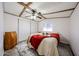 Inviting bedroom showcasing laminate flooring, a ceiling fan and neutral paint colors at 652 S Ellsworth Rd # 92, Mesa, AZ 85208