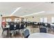 Large community room with plentiful seating, ceiling fans, and natural light from windows at 652 S Ellsworth Rd # 92, Mesa, AZ 85208