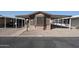 Charming single-story home featuring covered parking, neutral paint, and low maintenance landscaping at 652 S Ellsworth Rd # 92, Mesa, AZ 85208