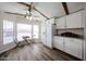 Bright eat-in kitchen with white cabinets, laminate floors, breakfast nook and updated appliances at 652 S Ellsworth Rd # 92, Mesa, AZ 85208