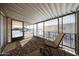 Enclosed patio with outdoor seating and wrought iron security screen at 652 S Ellsworth Rd # 92, Mesa, AZ 85208