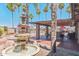 Inviting pool area with shaded seating, dining tables, and lush landscaping for outdoor enjoyment at 652 S Ellsworth Rd # 92, Mesa, AZ 85208