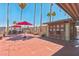 Inviting pool area with shaded seating, dining tables, and lush landscaping for outdoor enjoyment at 652 S Ellsworth Rd # 92, Mesa, AZ 85208
