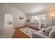 Inviting living room with bright window, neutral-toned sofa, and stylish rug at 750 S Cholla St, Gilbert, AZ 85233