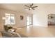 Bright living room with tile flooring, a large window, and comfortable seating with a view of the backyard at 750 S Cholla St, Gilbert, AZ 85233