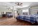 Bedroom with ample storage space, including built-in shelves and a mirrored closet at 796 E Pepper Dr, Casa Grande, AZ 85122