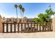 Balcony view showcasing the building's exterior, palm trees, and lush landscaping at 796 E Pepper Dr, Casa Grande, AZ 85122