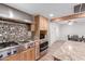 Well-equipped kitchen featuring stainless steel appliances, granite countertops, and a gas range at 796 E Pepper Dr, Casa Grande, AZ 85122