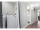 Functional laundry room with appliances and an adjacent door to the bathroom at 796 E Pepper Dr, Casa Grande, AZ 85122