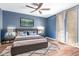 Stylish bedroom with a sleek bed frame, a soft rug, and access to the balcony at 796 E Pepper Dr, Casa Grande, AZ 85122