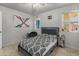 This bedroom features tile floors, white walls, and a comfortable bed at 8540 N 104Th Ave, Peoria, AZ 85345