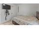 This bedroom features tile floors, white walls, and a comfortable bed at 8540 N 104Th Ave, Peoria, AZ 85345