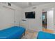 This bedroom features tile floors, white walls, and two twin beds at 8540 N 104Th Ave, Peoria, AZ 85345