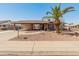 Charming single-story brick home with desert landscaping and covered carport at 8540 N 104Th Ave, Peoria, AZ 85345