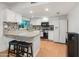 Modern kitchen with white cabinetry and stainless steel appliances at 8540 N 104Th Ave, Peoria, AZ 85345