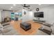 Open concept living room featuring a partial view of the kitchen at 8540 N 104Th Ave, Peoria, AZ 85345