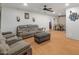 Spacious living room with laminate flooring and comfortable seating area at 8540 N 104Th Ave, Peoria, AZ 85345