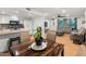 Open living space with dining area and partial view of the kitchen at 8540 N 104Th Ave, Peoria, AZ 85345