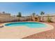 Beautiful backyard pool featuring rock landscaping and a storage tent at 8540 N 104Th Ave, Peoria, AZ 85345