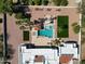 A stunning pool and spa are surrounded by patio and green spaces, perfect for outdoor living at 9900 N 52Nd St, Paradise Valley, AZ 85253