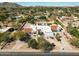 Beautiful home showcasing a circular driveway and lush landscaping in a serene setting at 9900 N 52Nd St, Paradise Valley, AZ 85253