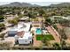 Expansive estate featuring a large pool, tennis court, and meticulously landscaped grounds at 9900 N 52Nd St, Paradise Valley, AZ 85253