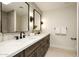 Bright bathroom with double vanity, stylish mirrors, and decorative tile accents at 9900 N 52Nd St, Paradise Valley, AZ 85253