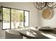 Dining room features a round table and a view of the outdoor landscape at 9900 N 52Nd St, Paradise Valley, AZ 85253