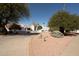 Well-manicured yard and garden surrounding the home, showcasing desert landscaping at 9900 N 52Nd St, Paradise Valley, AZ 85253