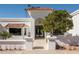 Inviting exterior featuring a tile roof, an arched entryway, and well-maintained landscaping at 9900 N 52Nd St, Paradise Valley, AZ 85253