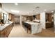 Bright kitchen features a skylight, an island with seating, and natural wood cabinetry at 9900 N 52Nd St, Paradise Valley, AZ 85253