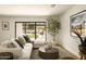 Bright living room boasts large sliding glass doors and stylish decor for relaxing at 9900 N 52Nd St, Paradise Valley, AZ 85253
