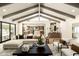 Open concept living room with vaulted ceiling flows into the kitchen with marble island at 9900 N 52Nd St, Paradise Valley, AZ 85253