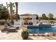 Inviting pool area with a shaded cabana, lounge chairs, and beautiful landscaping offering a luxurious outdoor experience at 9900 N 52Nd St, Paradise Valley, AZ 85253