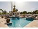 Beautiful pool featuring a tiled spa, waterfall feature, and a covered cabana for relaxing poolside at 9900 N 52Nd St, Paradise Valley, AZ 85253