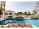 Stunning pool with a spa, water feature, and poolside cabana perfect for relaxing and entertaining outdoors at 9900 N 52Nd St, Paradise Valley, AZ 85253