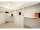 Walk-in closet with rows of shelving, drawers, and hanging rods at 9900 N 52Nd St, Paradise Valley, AZ 85253