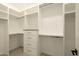 Bright walk-in closet offers built-in shelving and drawers at 9900 N 52Nd St, Paradise Valley, AZ 85253