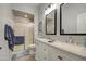 Bathroom includes double sinks with granite counters, a shower, and gray tile floors at 1021 S Greenfield Rd # 1178, Mesa, AZ 85206